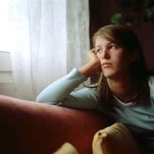 girl thinking by window